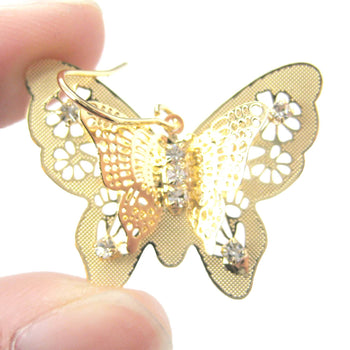 3D Butterfly Shaped Dangle Earrings in Gold With Floral Cut Out Details | DOTOLY | DOTOLY