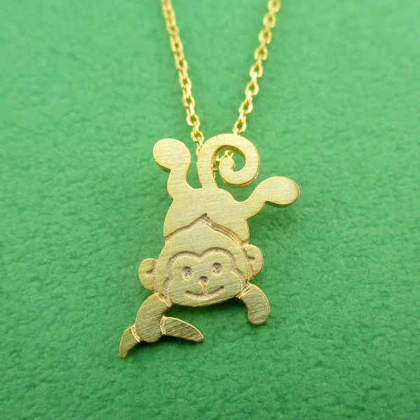 Dangling Cheeky Monkey With A Banana Shaped Pendant Necklace | DOTOLY