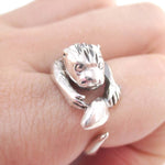 Holding a Fish Shaped Animal Wrap Around Ring in 925 Sterling Silver