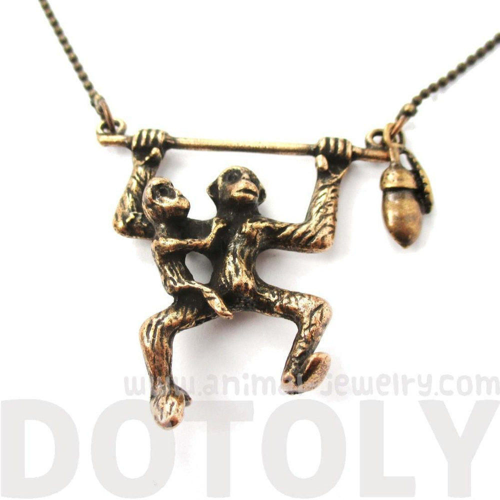 Mother and Baby Chimpanzee Monkey Swinging Shaped Animal Pendant Necklace in Bronze | DOTOLY