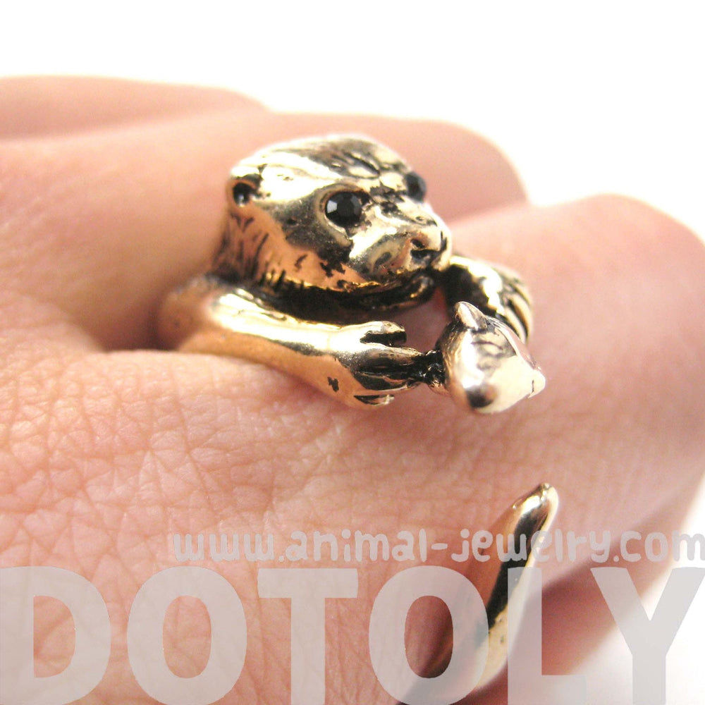 Otter Holding a Fish Shaped Animal Wrap Around Ring in Shiny Gold | US Sizes 4 to 9 | DOTOLY