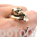 Otter Holding a Fish Shaped Animal Wrap Around Ring in Shiny Gold | US Sizes 4 to 9 | DOTOLY
