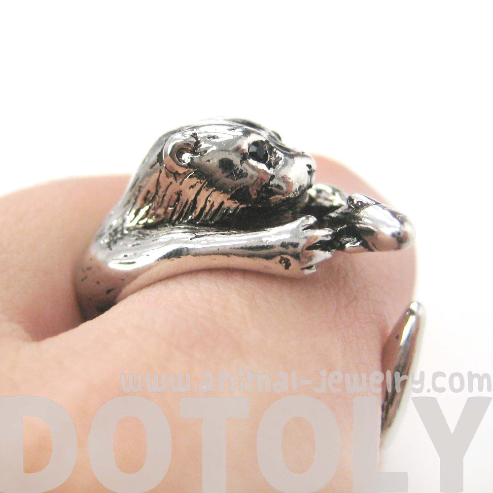 Otter Holding a Fish Shaped Animal Wrap Around Ring in Shiny Silver | US Sizes 4 to 9 | DOTOLY