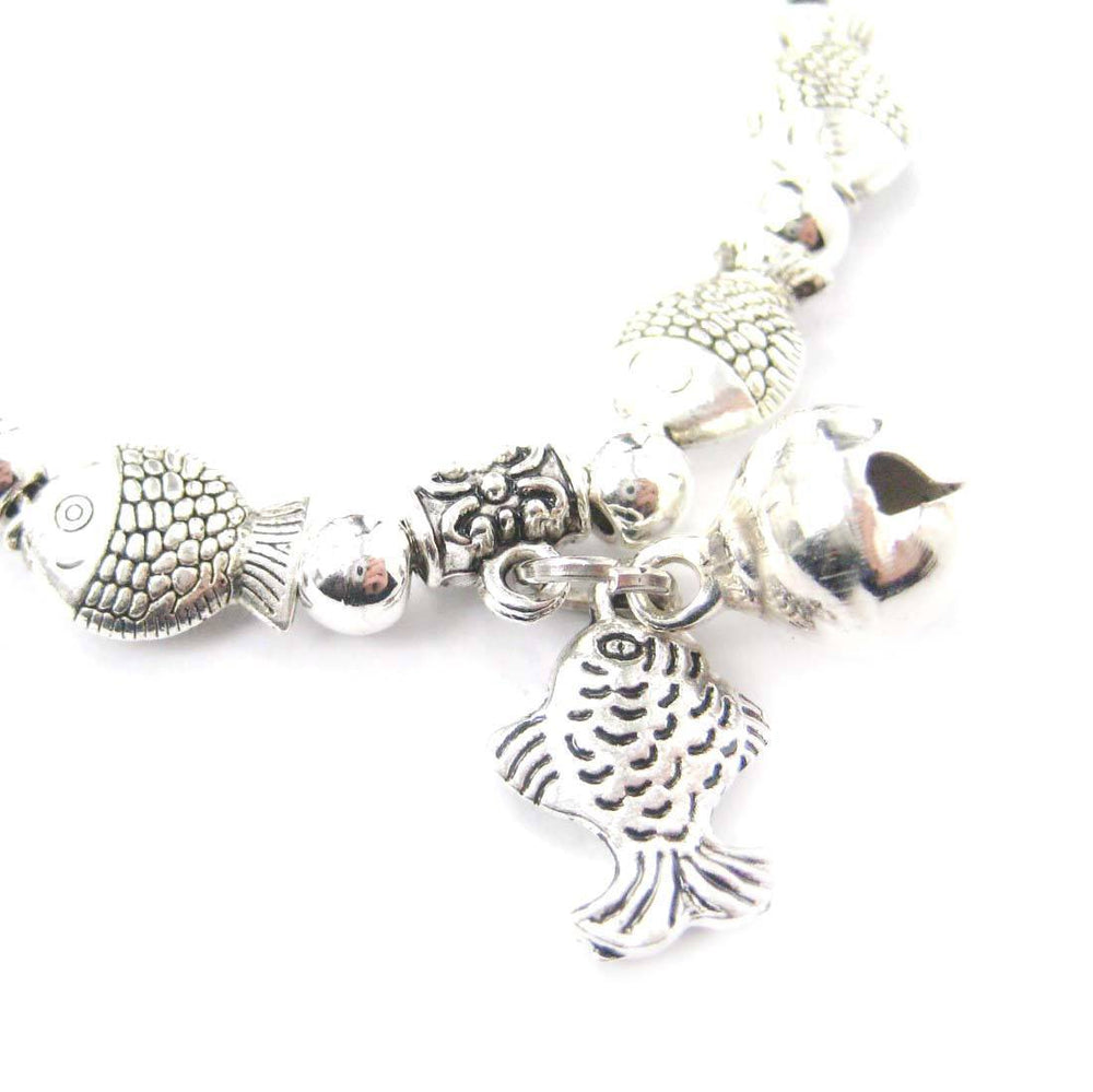 Row Of Fish Shaped Sea Animal Stretchy Bracelet in Silver | Animal Jewelry | DOTOLY
