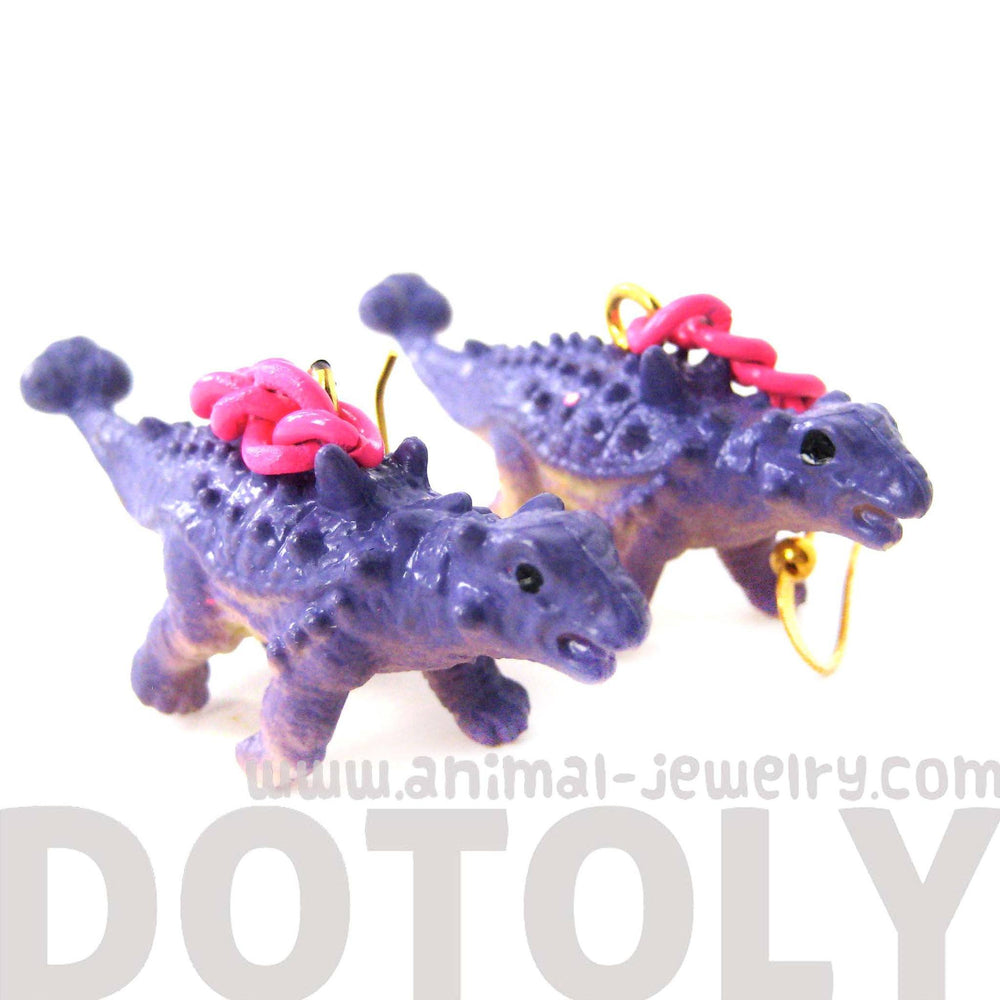 Scolosaurus Euoplocephalus Dinosaur Animal Figurine Shaped Dangle Earrings in Purple | DOTOLY