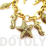 Sea Creatures Themed Charm Bracelet in Gold: Starfish Seahorse Seashell Dolphins | DOTOLY