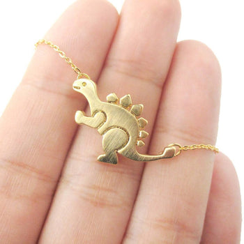 Stegosaurus Dinosaur Shaped Jurassic World Themed Pendant Necklace in Gold | DOTOLY