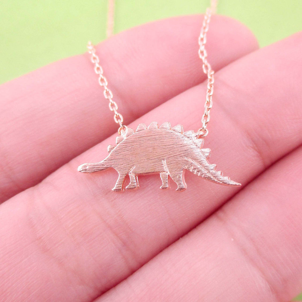 Stegosaurus Dinosaur Silhouette Jurassic World Themed Charm Necklace in Rose Gold | DOTOLY