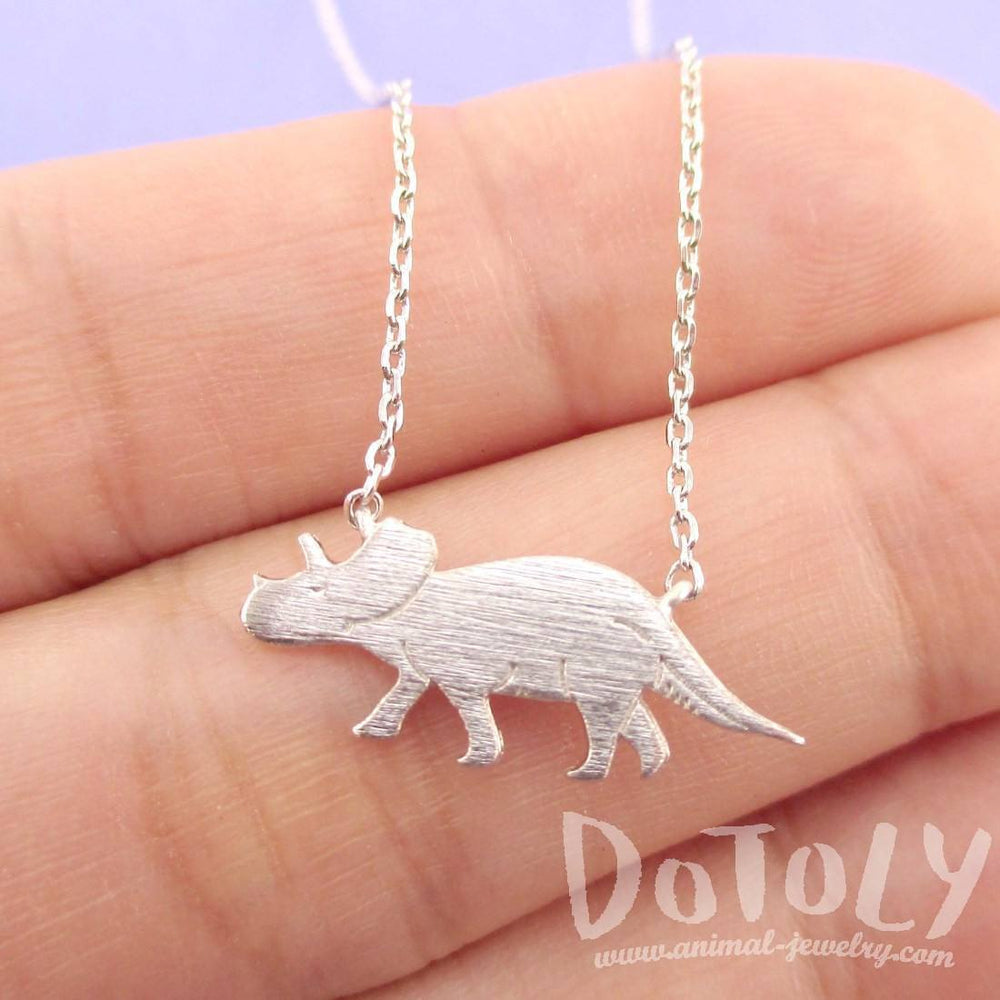 Triceratops Dinosaur Silhouette Jurassic World Themed Charm Necklace in Silver | DOTOLY