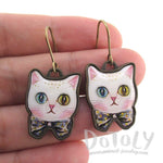 White Odd Eyed Cat With a Bow Shaped Enamel Dangle Earrings | DOTOLY