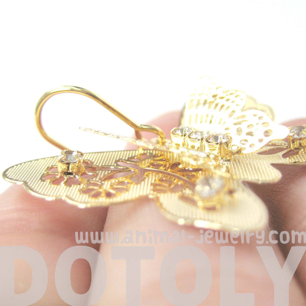 3D Butterfly Shaped Dangle Earrings in Gold With Floral Cut Out Details | DOTOLY | DOTOLY