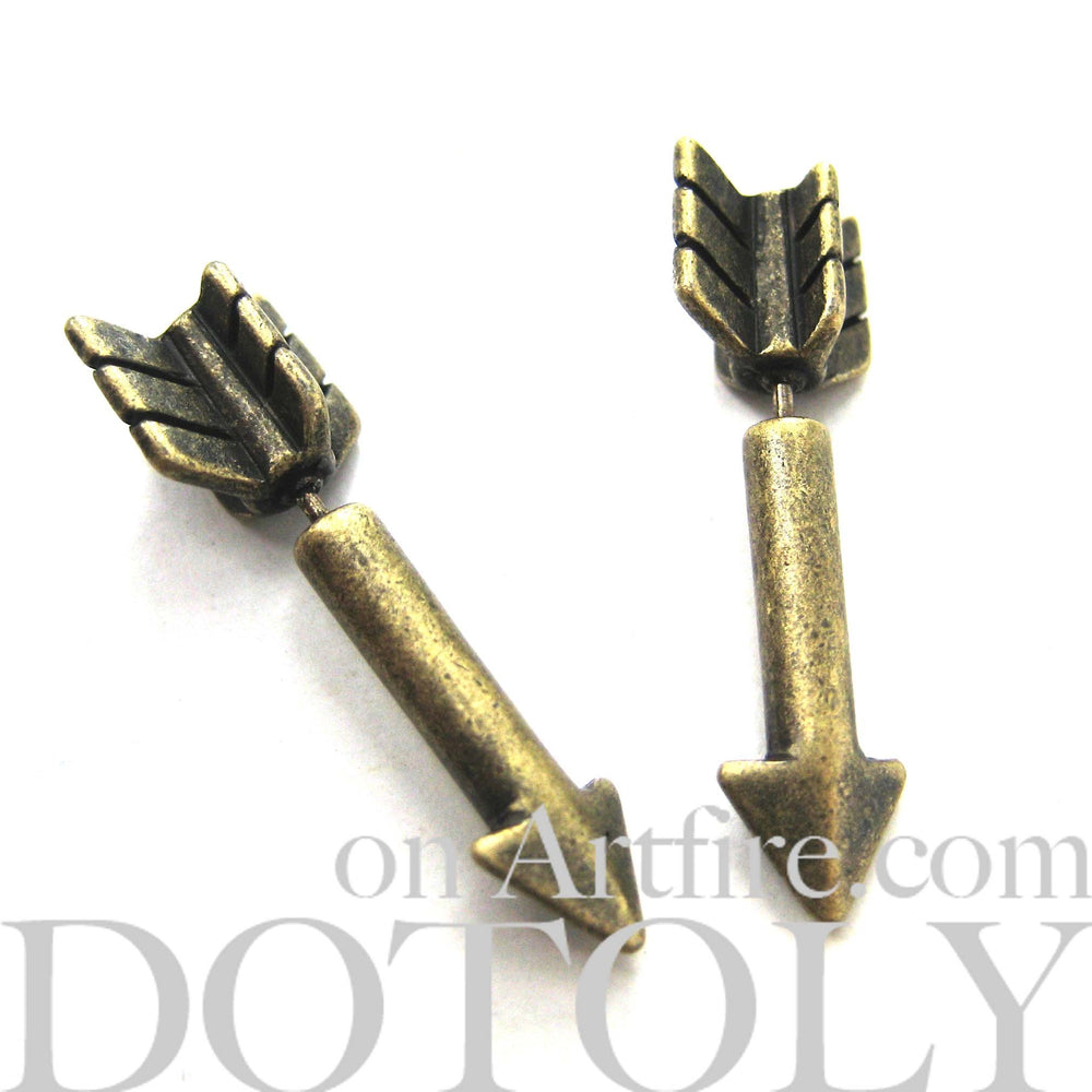 Fake Gauge Earrings: Realistic Arrow Shaped Faux Plug Stud Earrings in Brass | DOTOLY