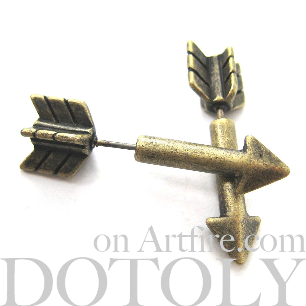 Fake Gauge Earrings: Realistic Arrow Shaped Faux Plug Stud Earrings in Brass | DOTOLY