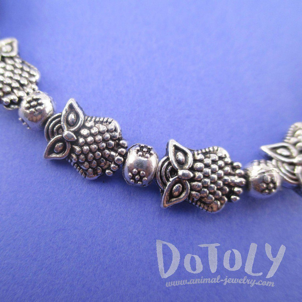 A Row Of Owls Shaped Beaded Stretchy Bracelet in Silver | DOTOLY