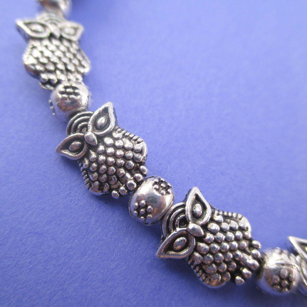 A Row Of Owls Shaped Beaded Stretchy Bracelet in Silver | DOTOLY