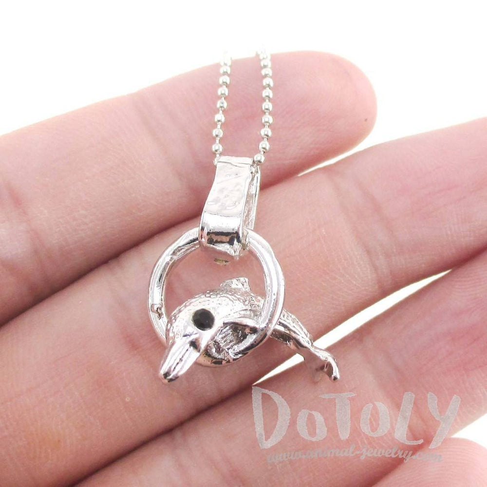 Baby Dolphin Jumping Through a Hoop Shaped Pendant Necklace in Silver