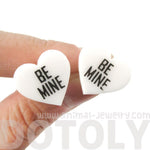 Be Mine Candy Heart Sweethearts Shaped Laser Cut Stud Earrings in White | DOTOLY