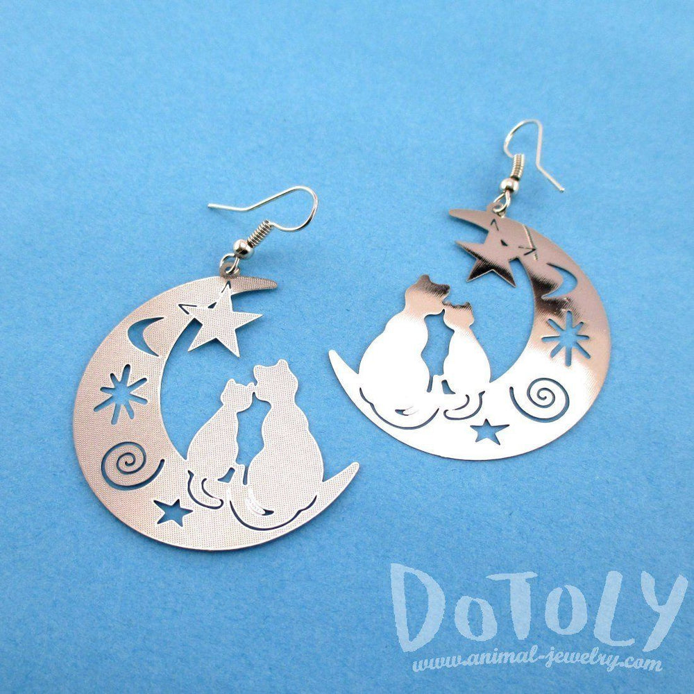 Cats on a Crescent Moon Cut Out Silhouette Shaped Dangle Earrings in Silver | Animal Jewelry | DOTOLY