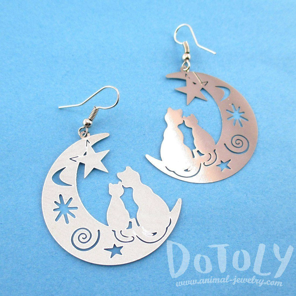 Cats on a Crescent Moon Cut Out Silhouette Shaped Dangle Earrings in Silver | Animal Jewelry | DOTOLY