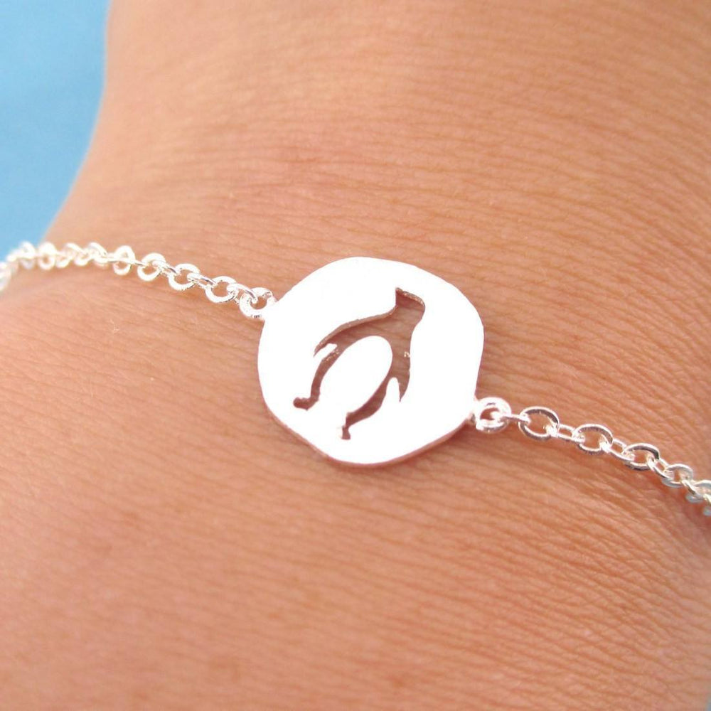 Charm Bracelet with Penguin Silhouette Cut Out in Silver | Animal Jewelry | DOTOLY