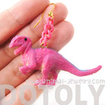 Classic Dinosaur Animal Figurine Shaped Dangle Earrings in Pink | DOTOLY