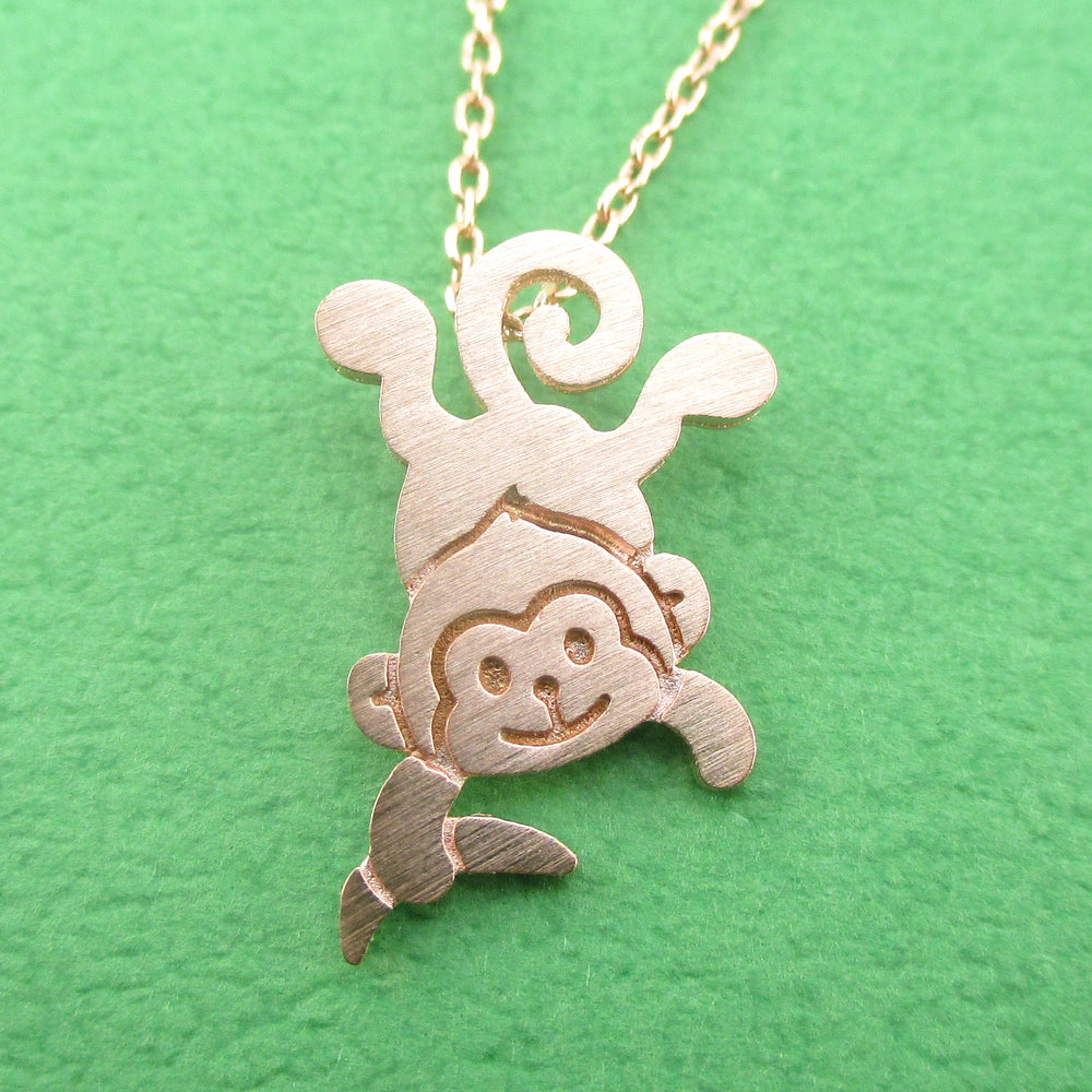 Dangling Cheeky Monkey With A Banana Shaped Pendant Necklace in Rose Gold | DOTOLY