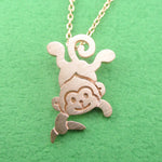 Dangling Cheeky Monkey With A Banana Shaped Pendant Necklace in Rose Gold | DOTOLY
