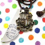 Antique Crest Badge Shield Pendant Necklace with Leather Ink Tag | DOTOLY