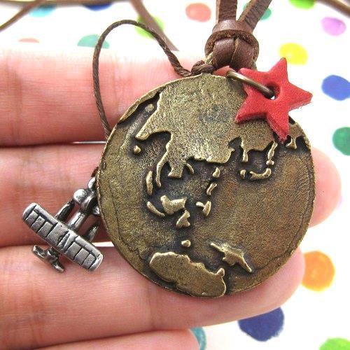 Globetrotter Travel Earth and Airplane Pendant Necklace in Bronze | DOTOLY