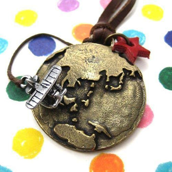 Globetrotter Travel Earth and Airplane Pendant Necklace in Bronze | DOTOLY