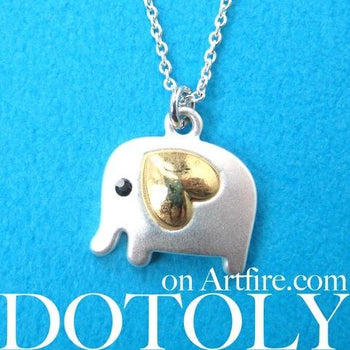 small-elephant-animal-charm-necklace-in-silver-with-gold-heart-detail