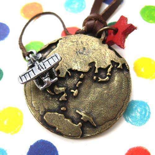 Globetrotter Travel Earth and Airplane Pendant Necklace in Bronze | DOTOLY