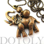 Baby Elephant Animal Pendant Necklace in Bronze with Bell Charm | DOTOLY