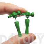 Fake Gauge Earrings: Realistic Hammer Shaped Front and Back Stud Earrings in Green | DOTOLY