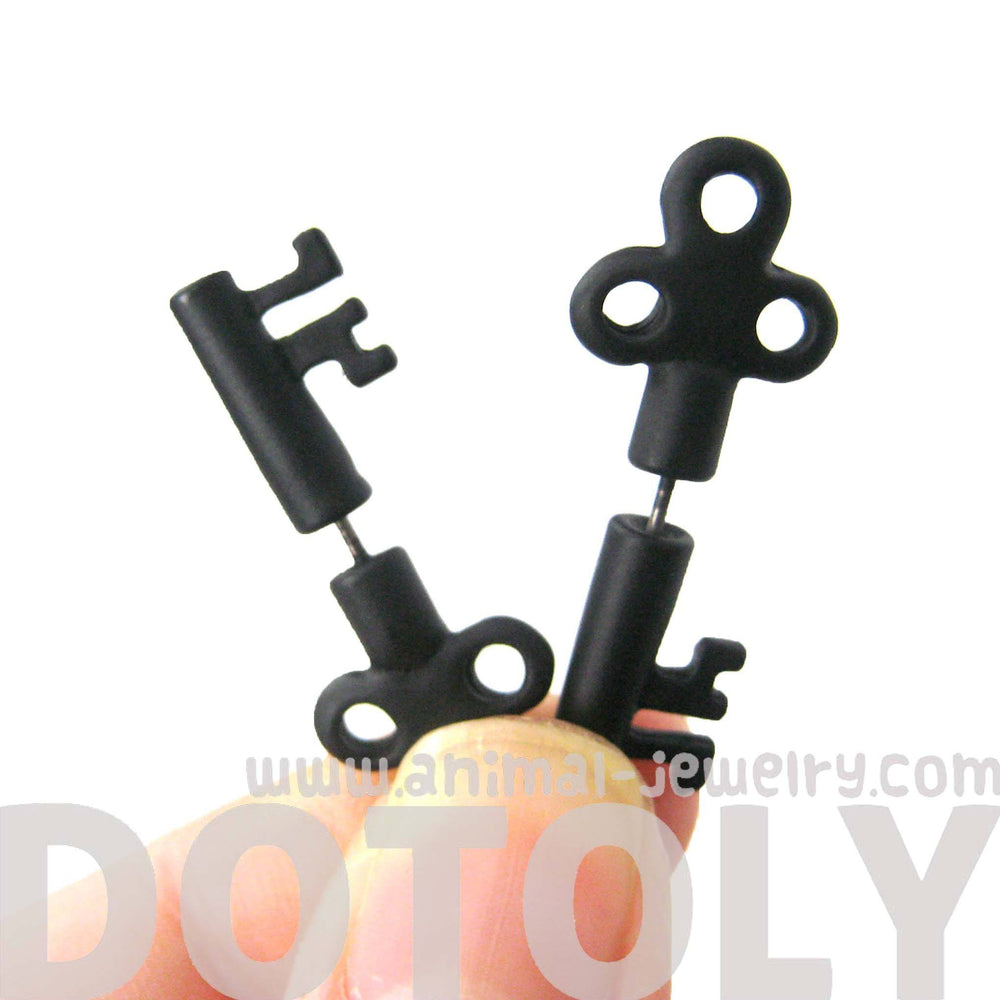 Fake Gauge Earrings: Skeleton Key Shaped Faux Plug Stud Earrings in Black | DOTOLY