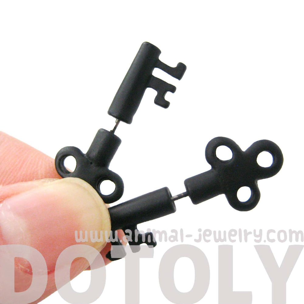 Fake Gauge Earrings: Skeleton Key Shaped Faux Plug Stud Earrings in Black | DOTOLY