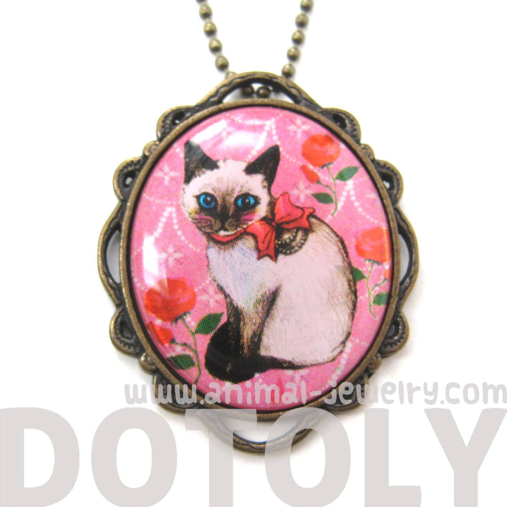 Fancy Siamese Kitty Cat Shaped Illustrated Oval Pendant Necklace in Pink with Bows and Roses | DOTOLY