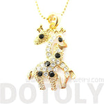 Giraffes with Necks Entwined Animal Shaped Pendant Necklace in Gold with Rhinestones | DOTOLY