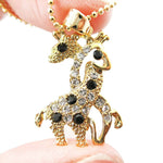 Giraffes with Necks Entwined Animal Shaped Pendant Necklace in Gold with Rhinestones | DOTOLY