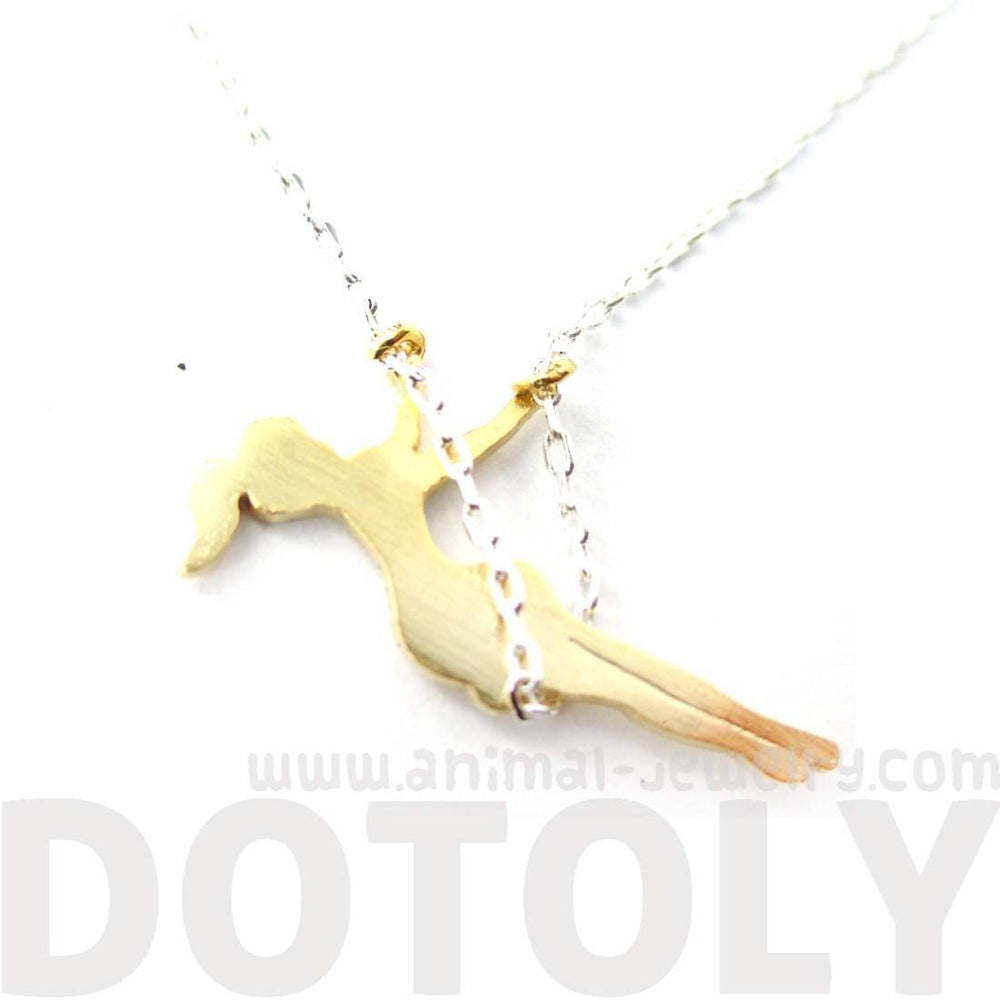 Girl Swinging on a Swing Acrobat Charm Necklace in Silver and Gold | DOTOLY | DOTOLY