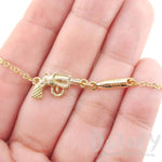 Gun and Bullet Revolver Shaped Charm Necklace in Gold | DOTOLY | DOTOLY