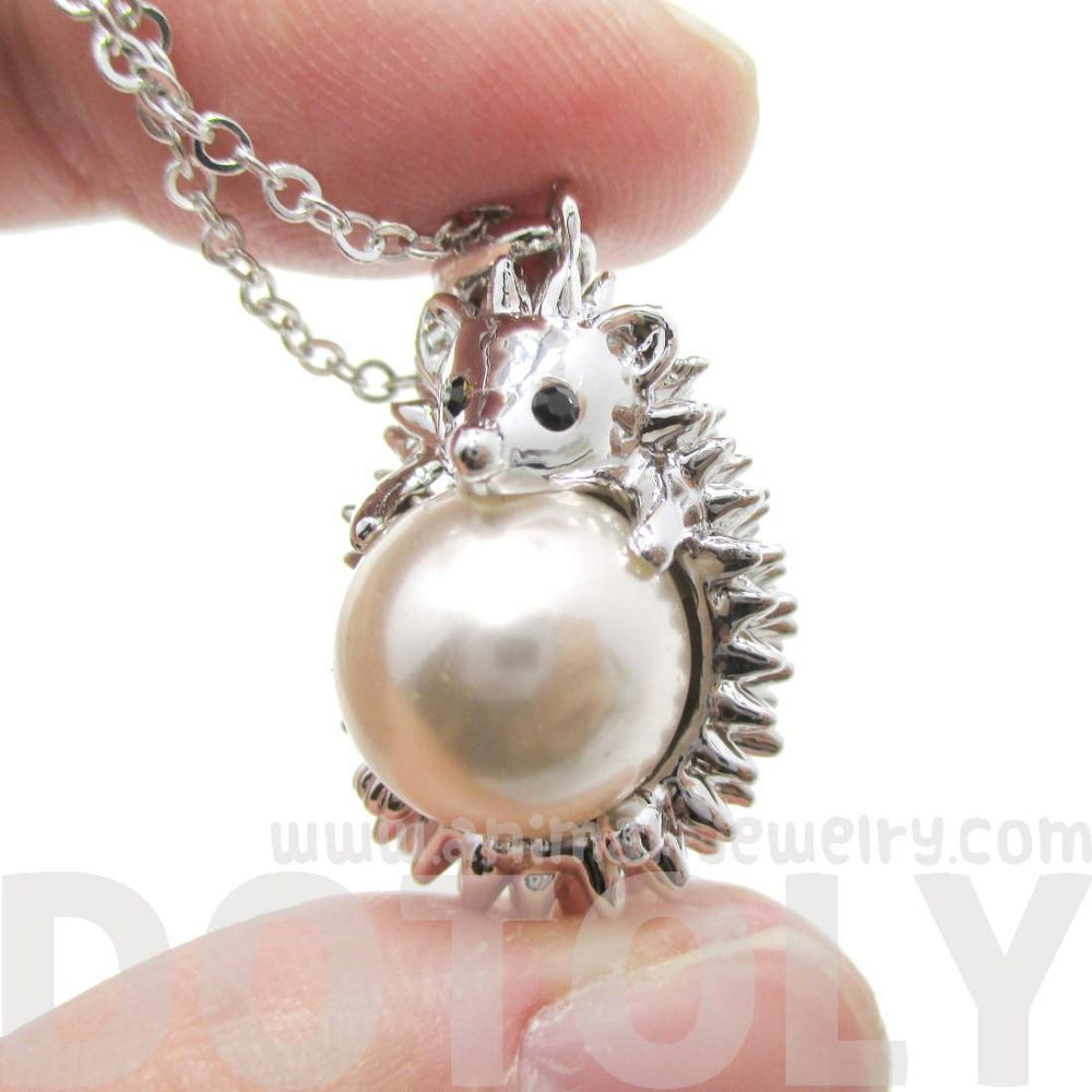 Hedgehog Porcupine Hugging a Pearl Shaped Animal Pendant Necklace in Silver | DOTOLY