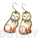 Illustrated Fancy Kitty Cat Animal Dangle Earrings in White with Blue Bow | DOTOLY | DOTOLY