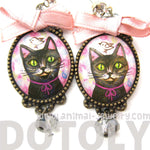 Kitty Cat Portrait Illustrated Drop Stud Earrings in Black with Bows | Animal Jewelry | DOTOLY