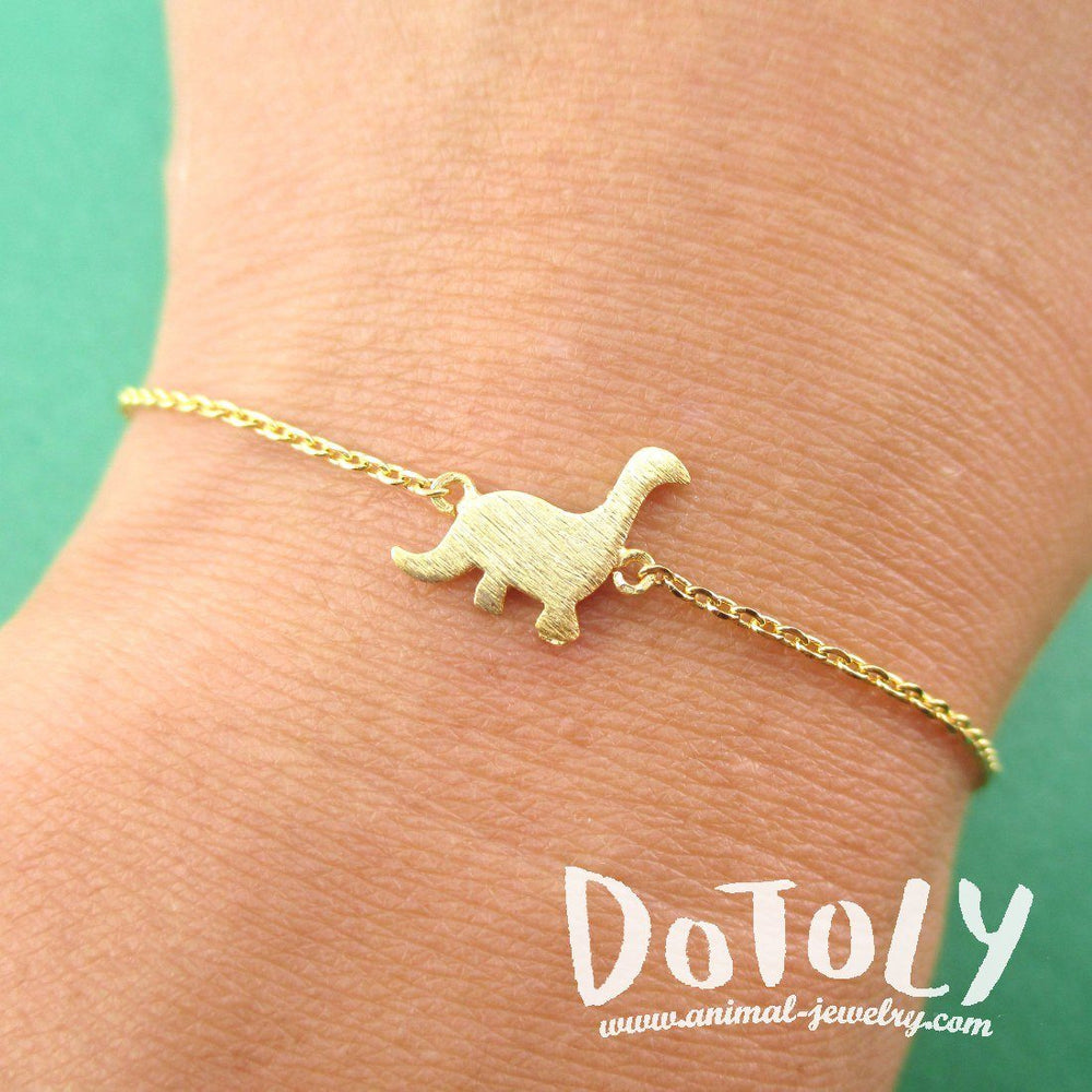 Long Neck Dinosaur Sauropoda Silhouette Shaped Charm Bracelet in Gold | DOTOLY