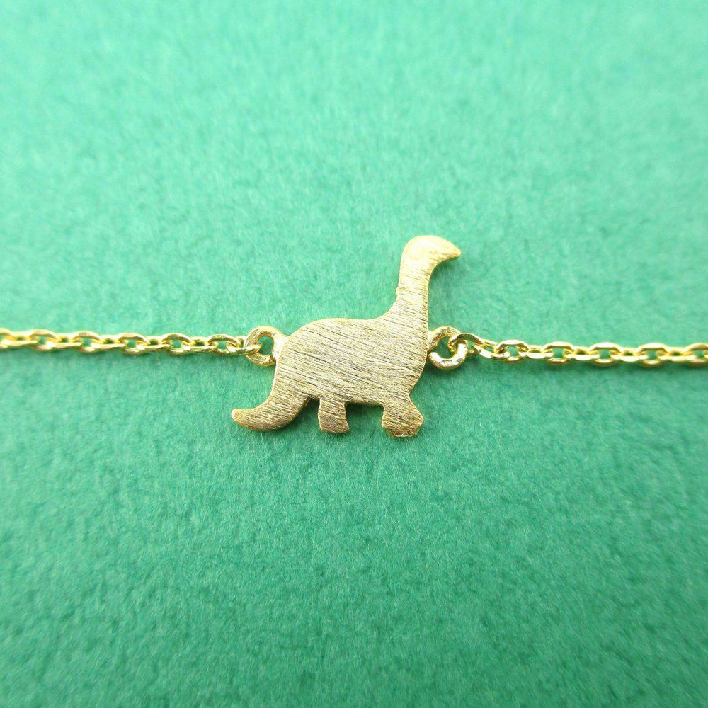 Long Neck Dinosaur Sauropoda Silhouette Shaped Charm Bracelet in Gold | DOTOLY