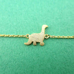 Long Neck Dinosaur Sauropoda Silhouette Shaped Charm Bracelet in Gold | DOTOLY