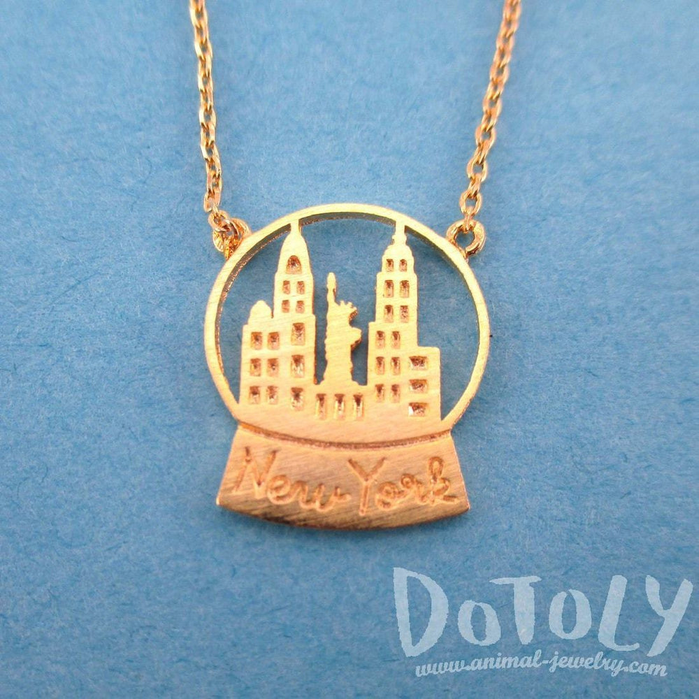 New York Skyline Snow Globe Pendant Necklace in Gold | DOTOLY | DOTOLY
