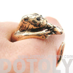 Otter Holding a Fish Shaped Animal Wrap Around Ring in Shiny Gold | US Sizes 4 to 9 | DOTOLY