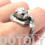 Otter Holding a Fish Shaped Animal Wrap Around Ring in Silver | US Sizes 4 to 9 Available | DOTOLY